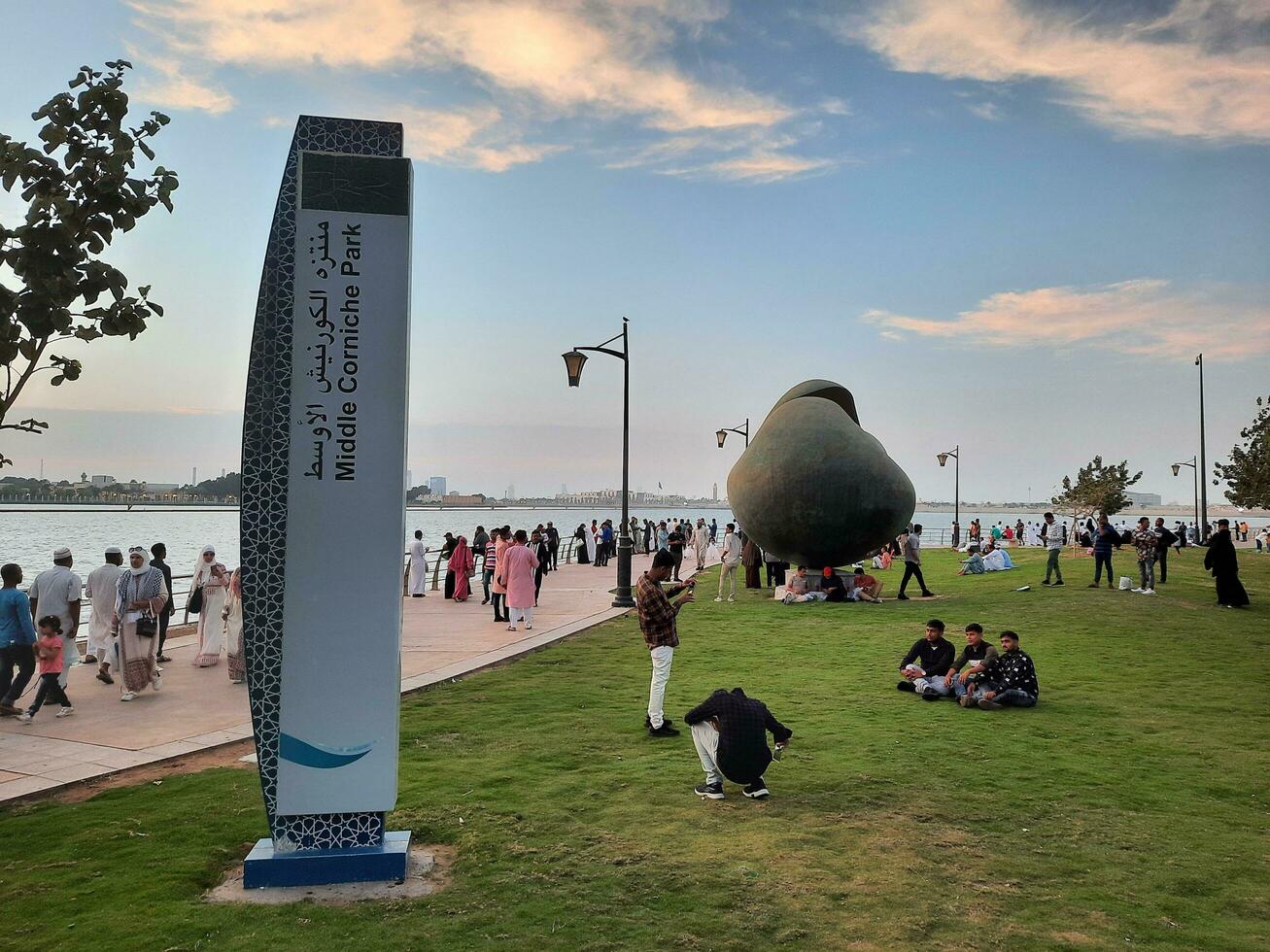 Jeddah, Saudi Arabia, April 2023 - Beautiful evening view of Jeddah Corniche. A large number of people are seen in the park of Jeddah Corniche. photo