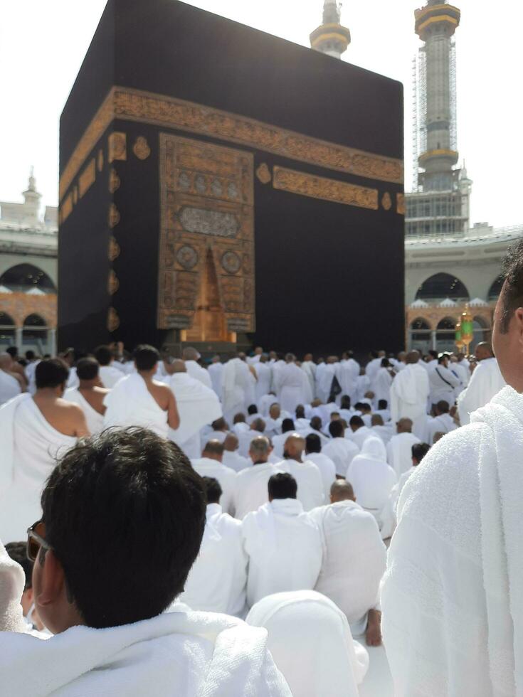 Mecca, Saudi Arabia, April 2023 - Pilgrims from all over the world are present in the courtyard of Masjid al-Haram for Tawaf. photo