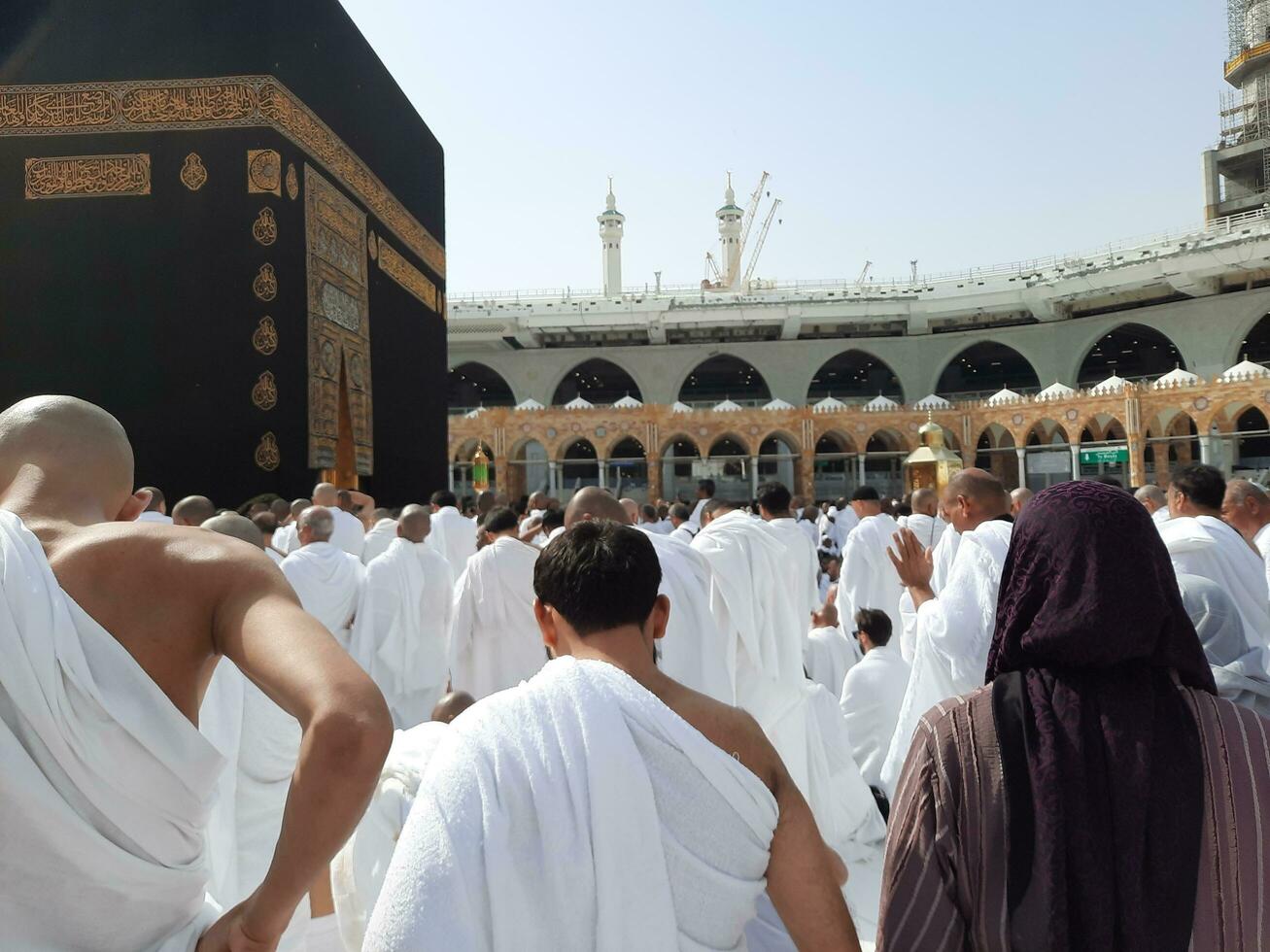 Mecca, Saudi Arabia, April 2023 - Pilgrims from all over the world are present in the courtyard of Masjid al-Haram for Tawaf. photo
