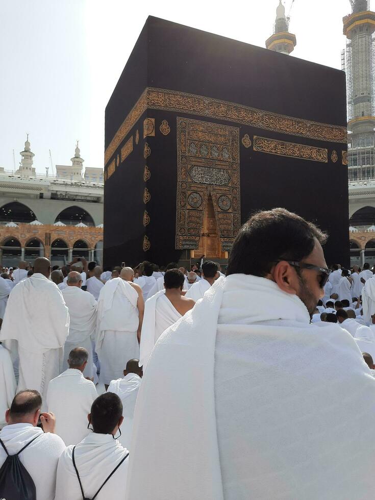 Mecca, Saudi Arabia, April 2023 - Pilgrims from all over the world are present in the courtyard of Masjid al-Haram for Tawaf. photo