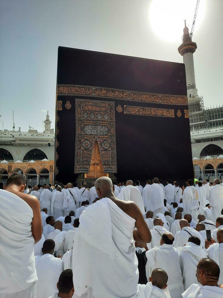 Mecca, Saudi Arabia, April 2023 - Pilgrims from all over the world are present in the courtyard of Masjid al-Haram for Tawaf. photo