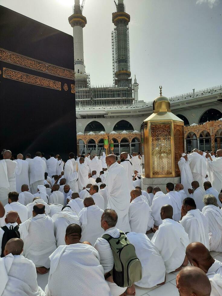 Mecca, Saudi Arabia, April 2023 - Pilgrims from all over the world are present in the courtyard of Masjid al-Haram for Tawaf. photo