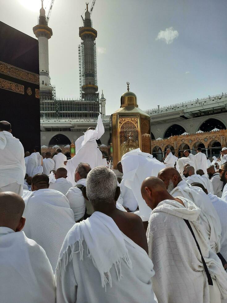Mecca, Saudi Arabia, April 2023 - Pilgrims from all over the world are present in the courtyard of Masjid al-Haram for Tawaf. photo