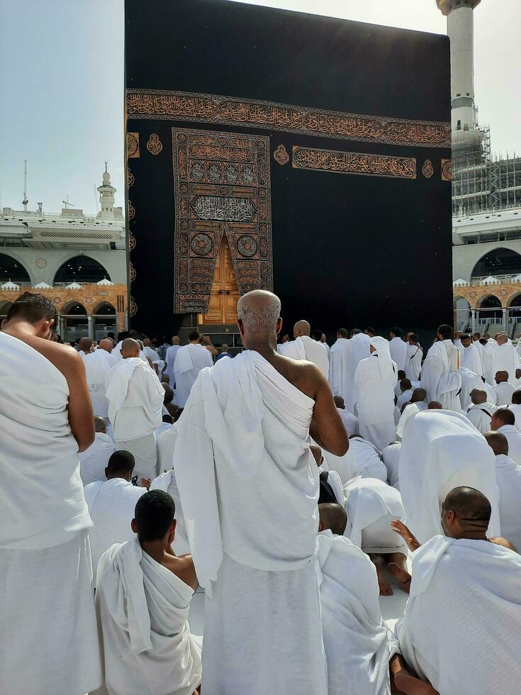 Mecca, Saudi Arabia, April 2023 - Pilgrims from all over the world are present in the courtyard of Masjid al-Haram for Tawaf. photo