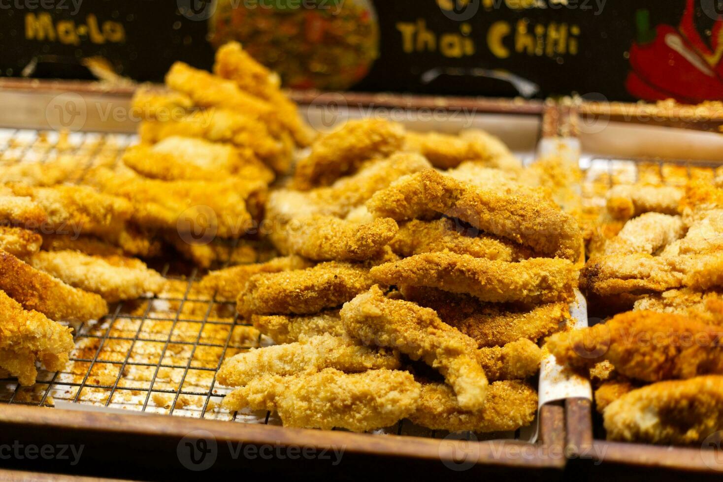 crispy fried chicken in thai food market photo