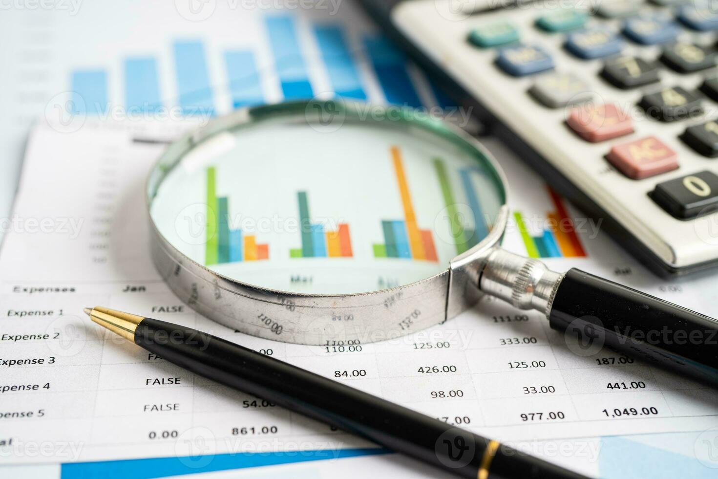 Magnifying glass on graph paper. Financial development, Banking Account, Statistics, Investment Analytic research data economy, Business concept. photo