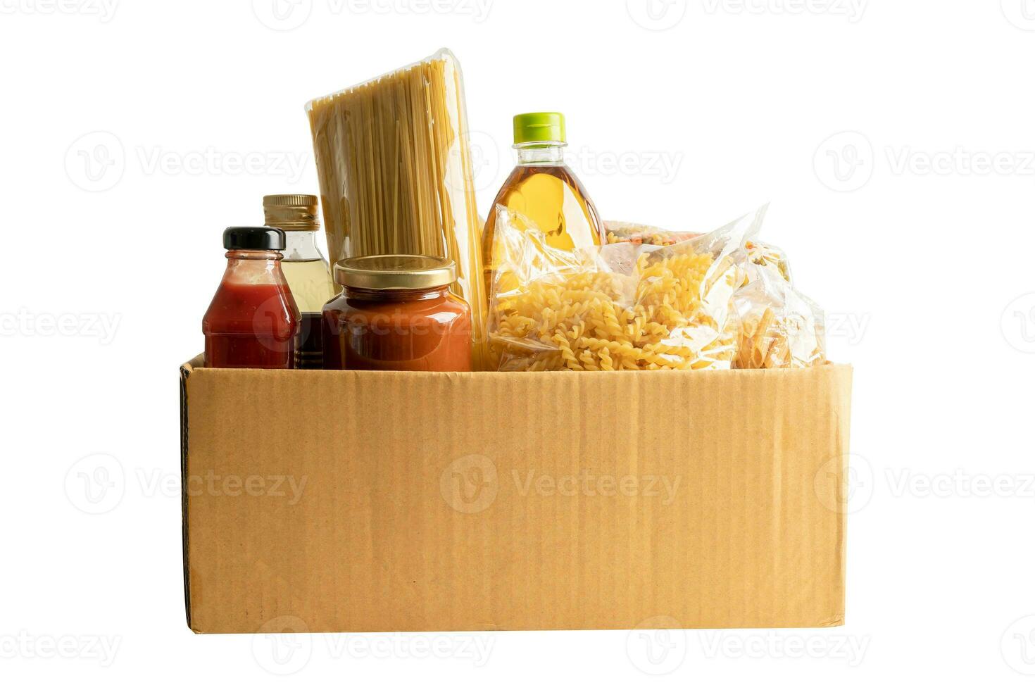 Foodstuff for donation isolated on white background with clipping path, storage and delivery. Various food, pasta, cooking oil and canned food in cardboard box. photo
