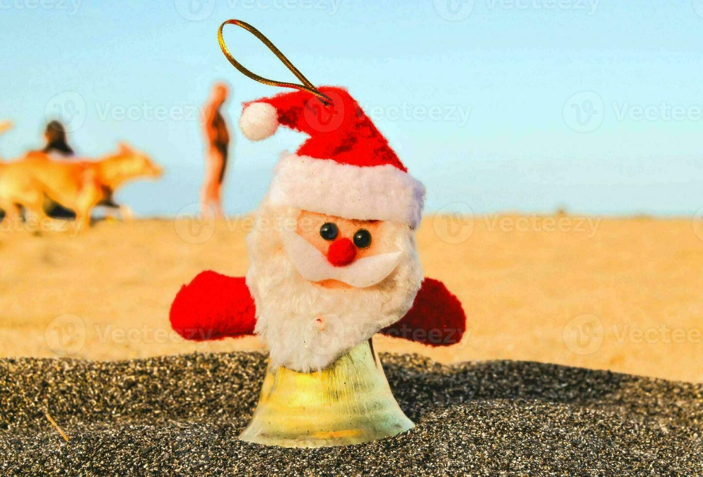 Santa decoration on the sand photo