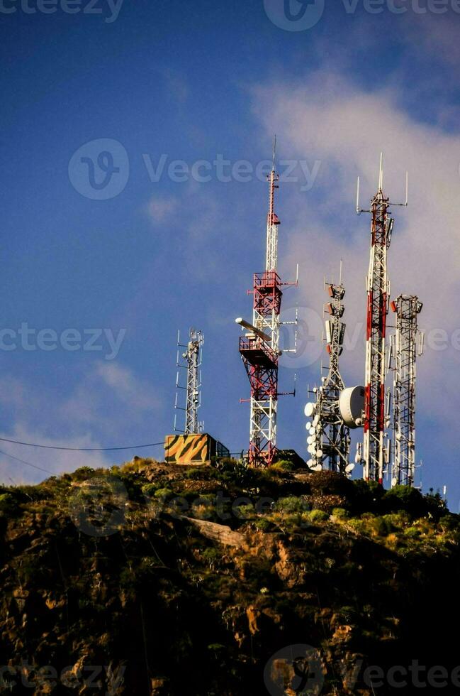 Radio antennas on the hill photo