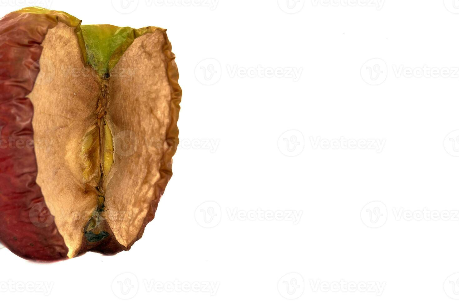 Wrinkled apple isolated on white background with clipping path. photo