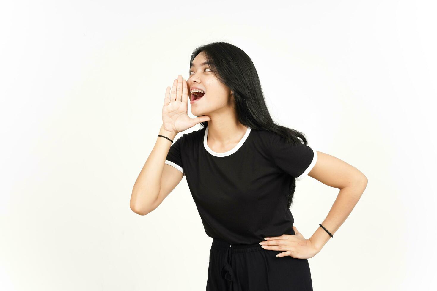 Making Announcement with hands over mouth Of Beautiful Asian Woman Isolated On White Background photo