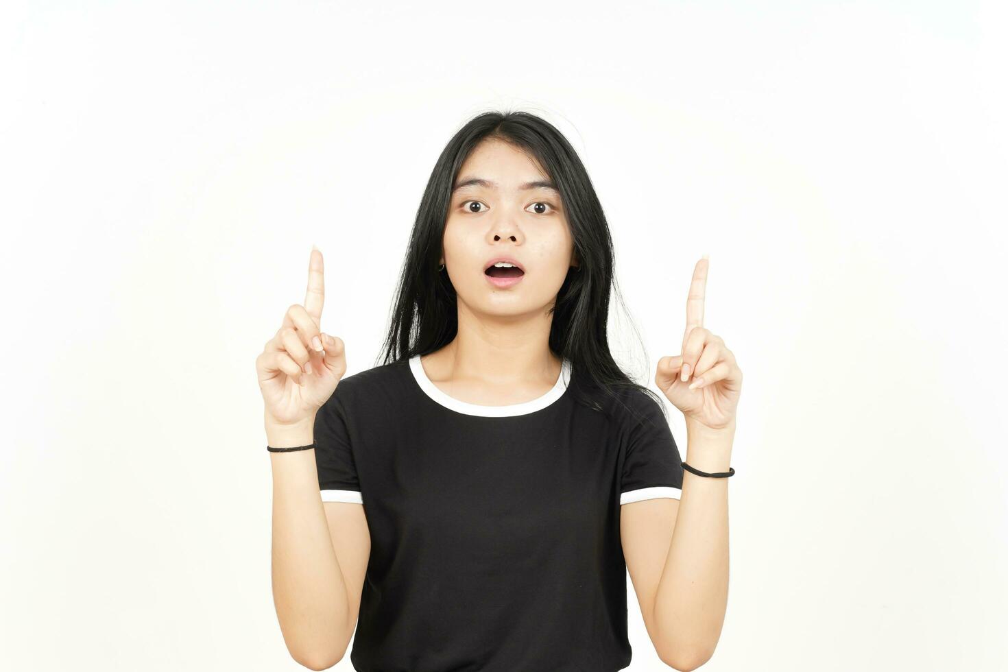 Shocked Face And Pointing Up showing blank copy space Of Beautiful Asian Woman Isolated On White photo