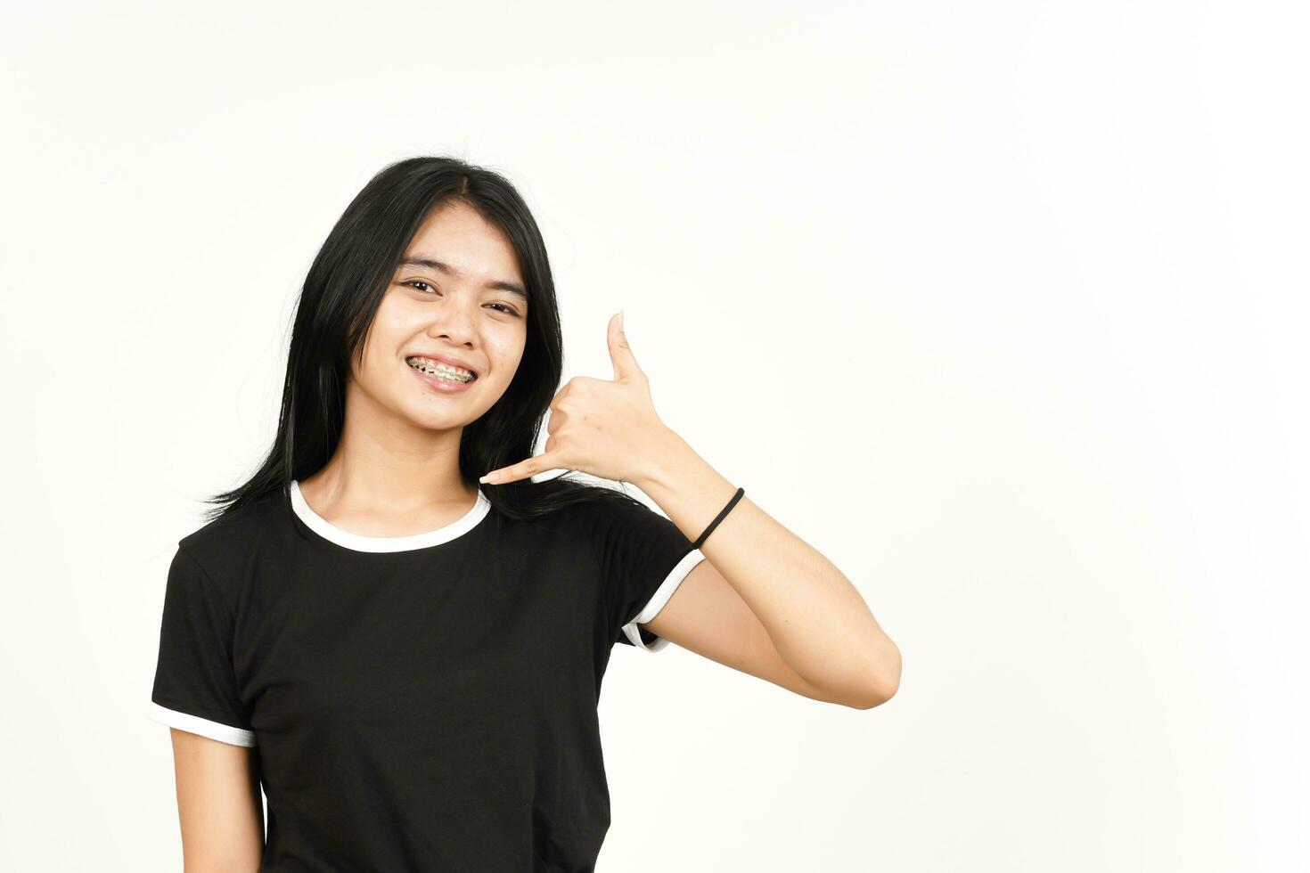 Making phone gesture or Call me back sign Of Beautiful Asian Woman Isolated On White Background photo