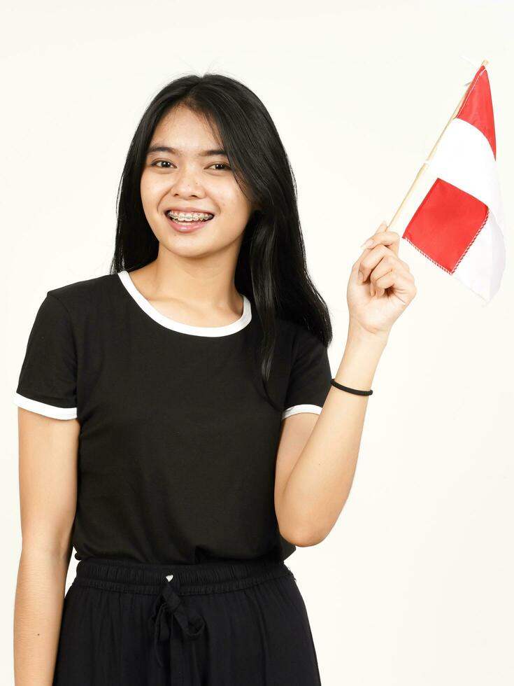 Smiling and Holding Indonesian Flag Of Beautiful Asian Woman Isolated On White Background photo