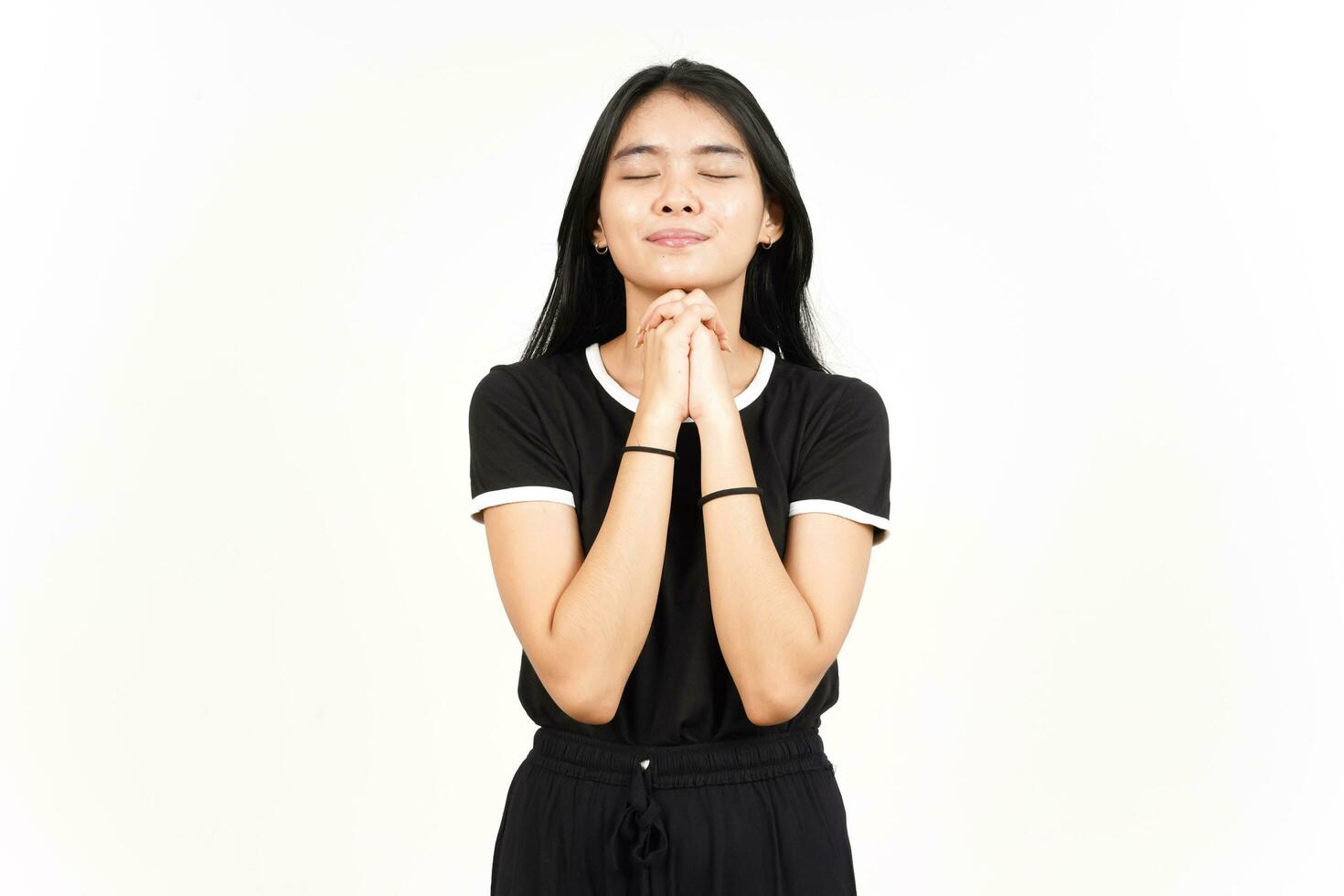 Folding hand closed eye and praying of Beautiful Asian Woman Isolated On White Background photo