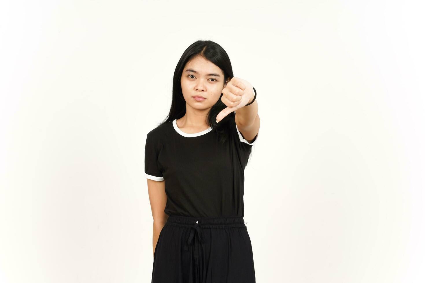 Showing Thumbs Down Sign Of Beautiful Asian Woman Isolated On White Background photo