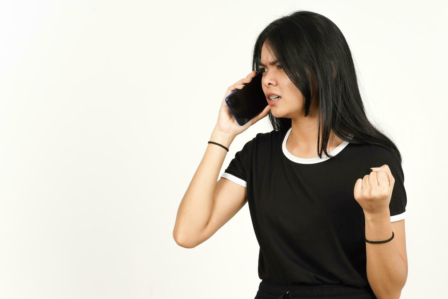 Make a Phone Call Using smartphone with angry face Of Beautiful Asian Woman Isolated On White photo