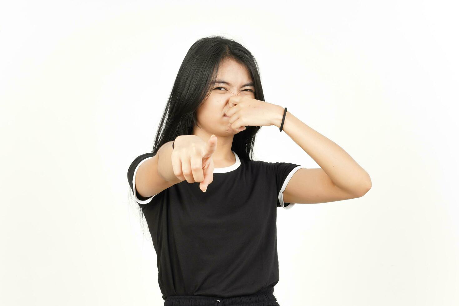 Smelling something stinky and disgusting of Beautiful Asian Woman Isolated On White Background photo