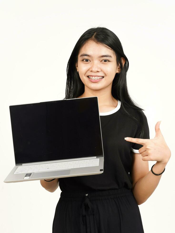 Showing and Presentation laptop blank screen Of Beautiful Asian Woman Isolated On White Background photo