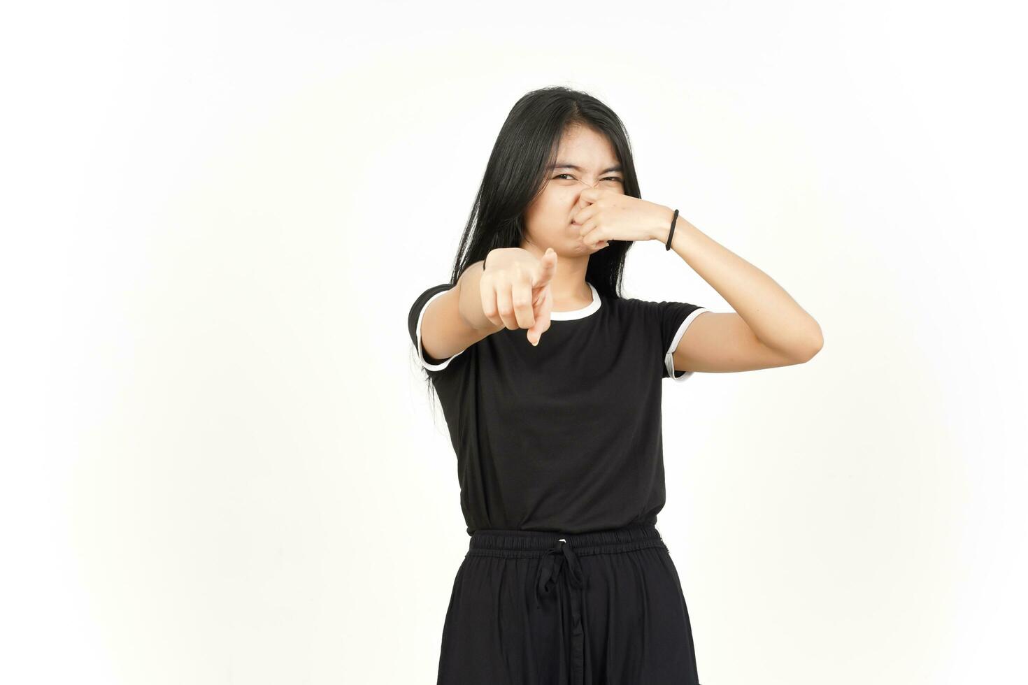 Smelling something stinky and disgusting of Beautiful Asian Woman Isolated On White Background photo