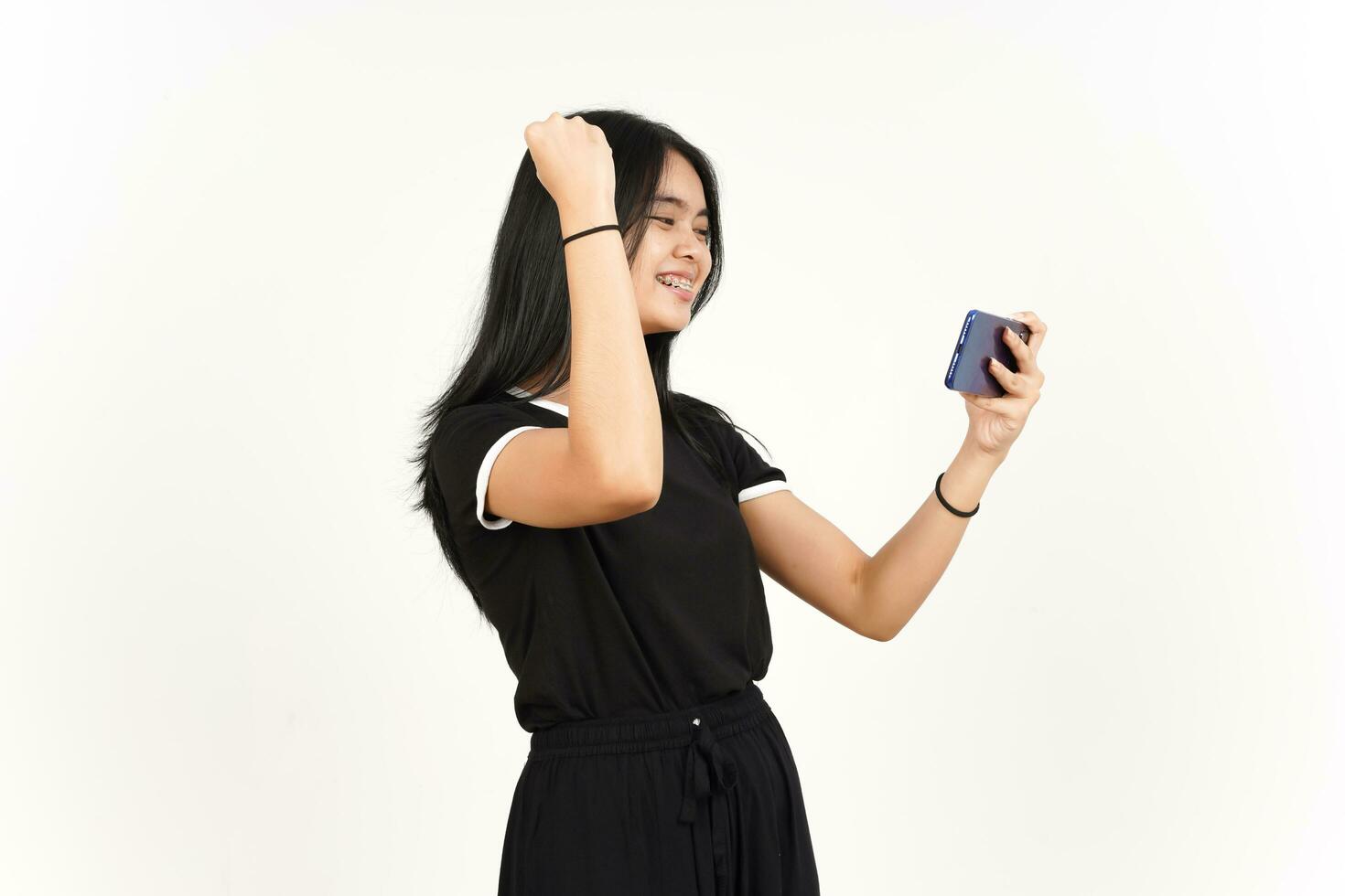 Playing Mobile Game on Smartphone Of Beautiful Asian Woman Isolated On White Background photo