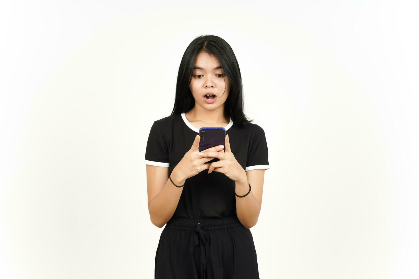 Holding or Using Smartphone with Shocked Face Of Beautiful Asian Woman Isolated On White Background photo
