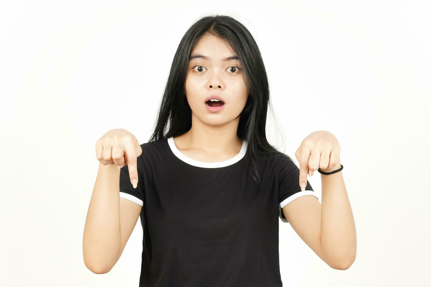 Shocked Face And Pointing Down showing blank copy space Of Beautiful Asian Woman Isolated On White photo