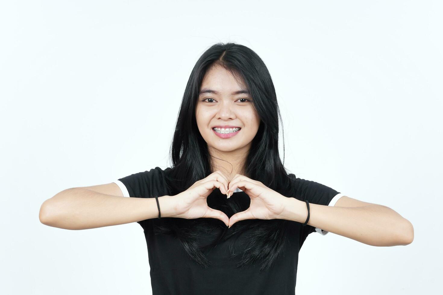 Showing Love Heart Sign Of Beautiful Asian Woman Isolated On White Background photo