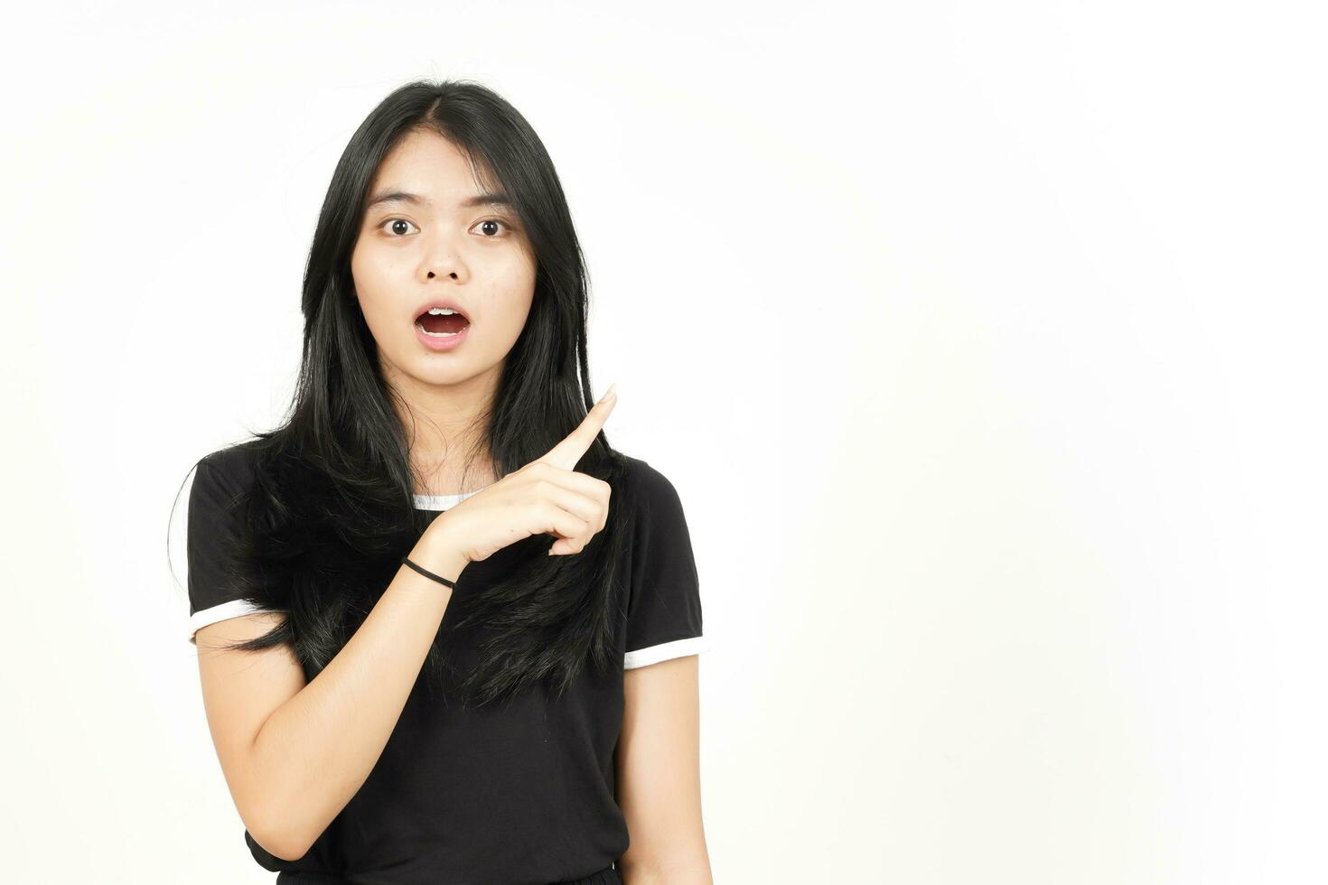 Shocked face Showing Product and Pointing Side using forefinger Of Beautiful Asian Woman photo