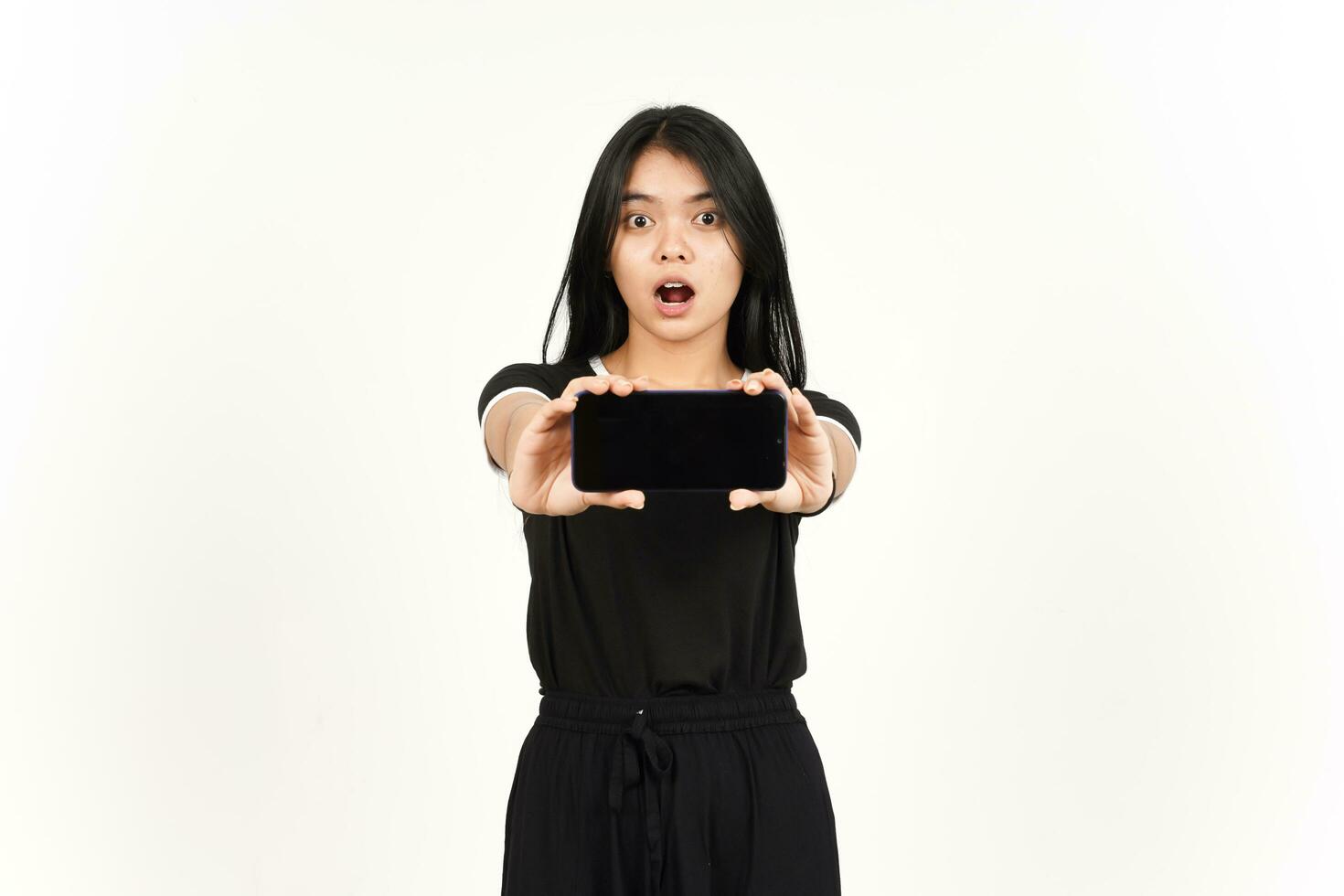 Showing blank smartphone screen Of Beautiful Asian Woman Isolated On White Background photo
