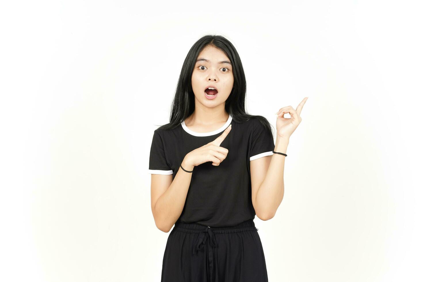 WOW Face and Showing Product and Pointing Side using forefinger Of Beautiful Asian Woman Isolated photo