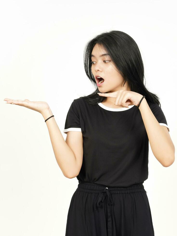 Showing and Presenting Product on Open Palm Of Beautiful Asian Woman Isolated On White Background photo