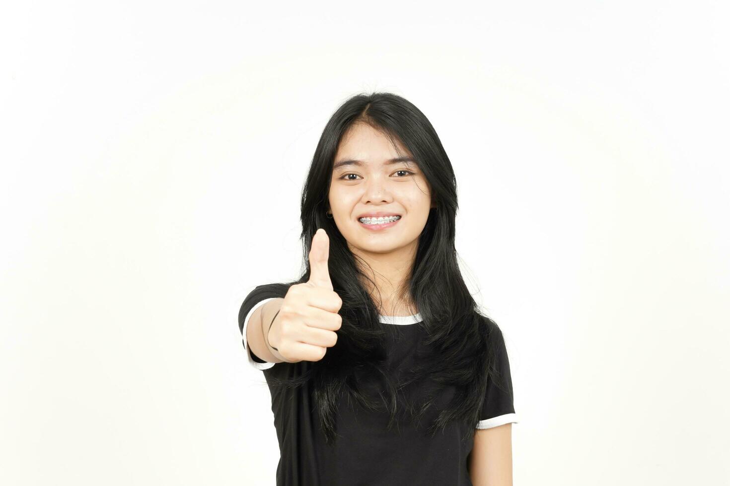Showing Thumbs Up Of Beautiful Asian Woman Isolated On White Background photo