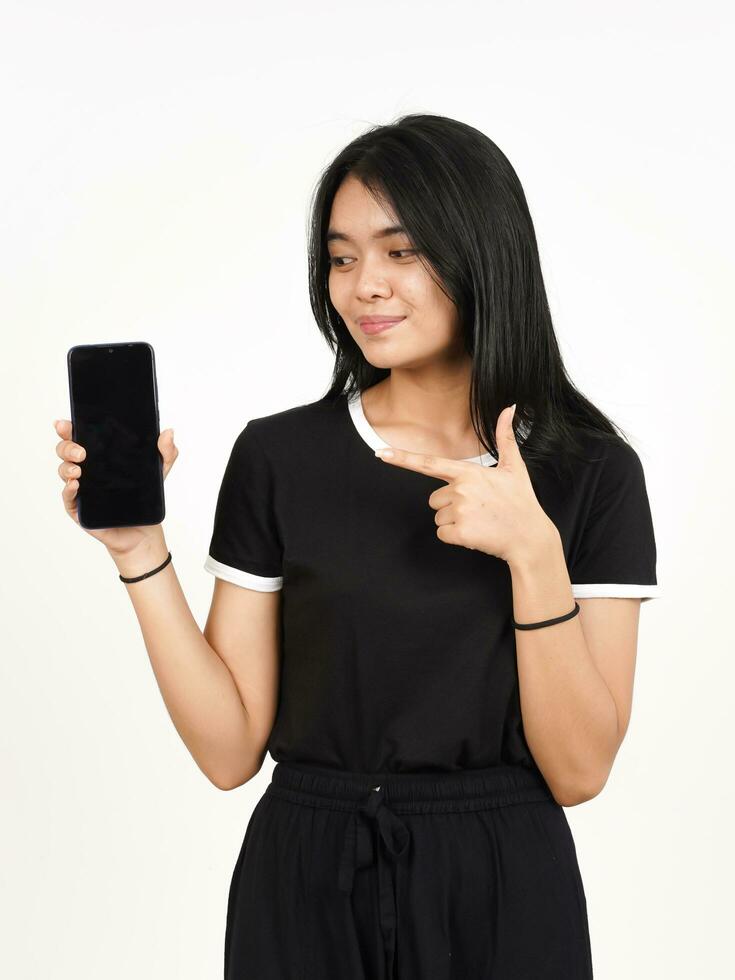 Smile and Showing Apps or Ads On Blank Screen Smartphone Of Beautiful Asian Woman Isolated On White photo