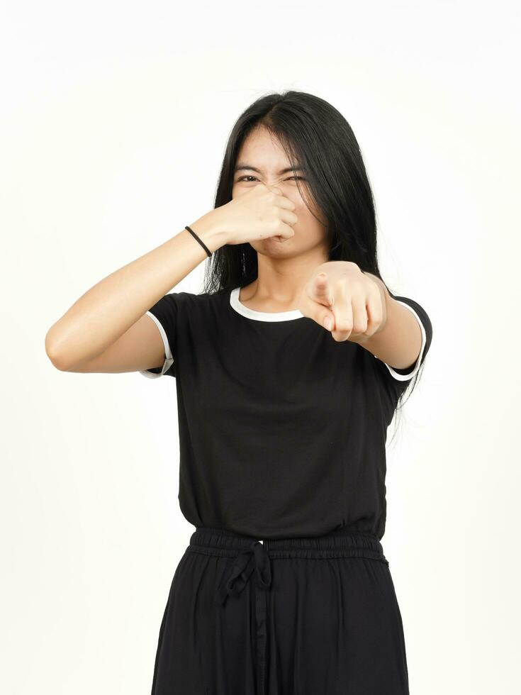 Smelling something stinky and disgusting of Beautiful Asian Woman Isolated On White Background photo