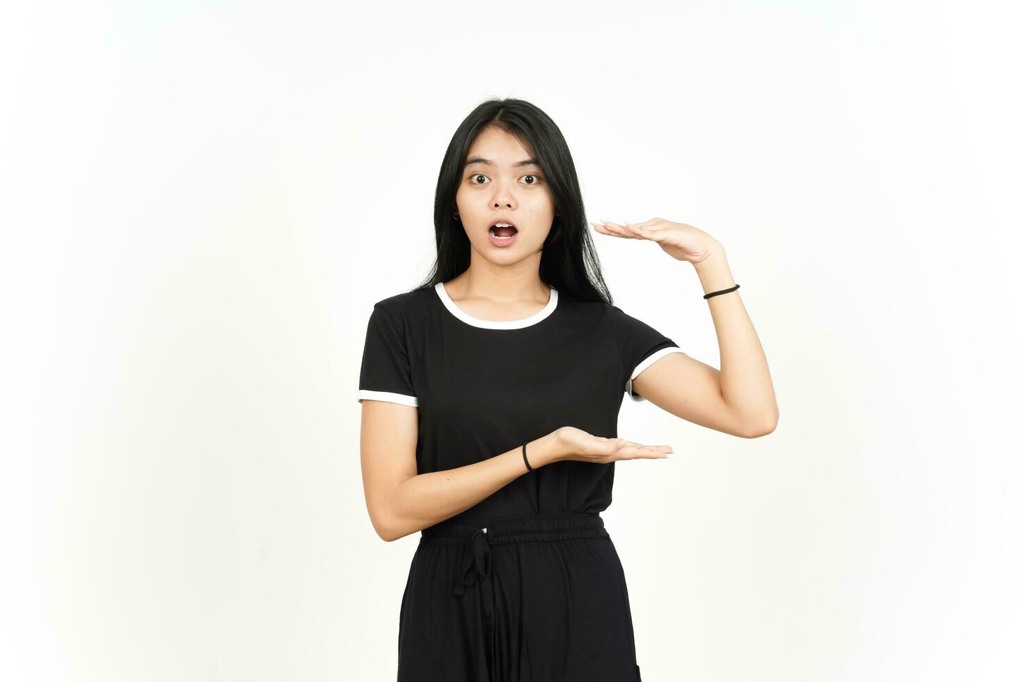 Measuring and Showing Big Sign Product Of Beautiful Asian Woman Isolated On White Background photo