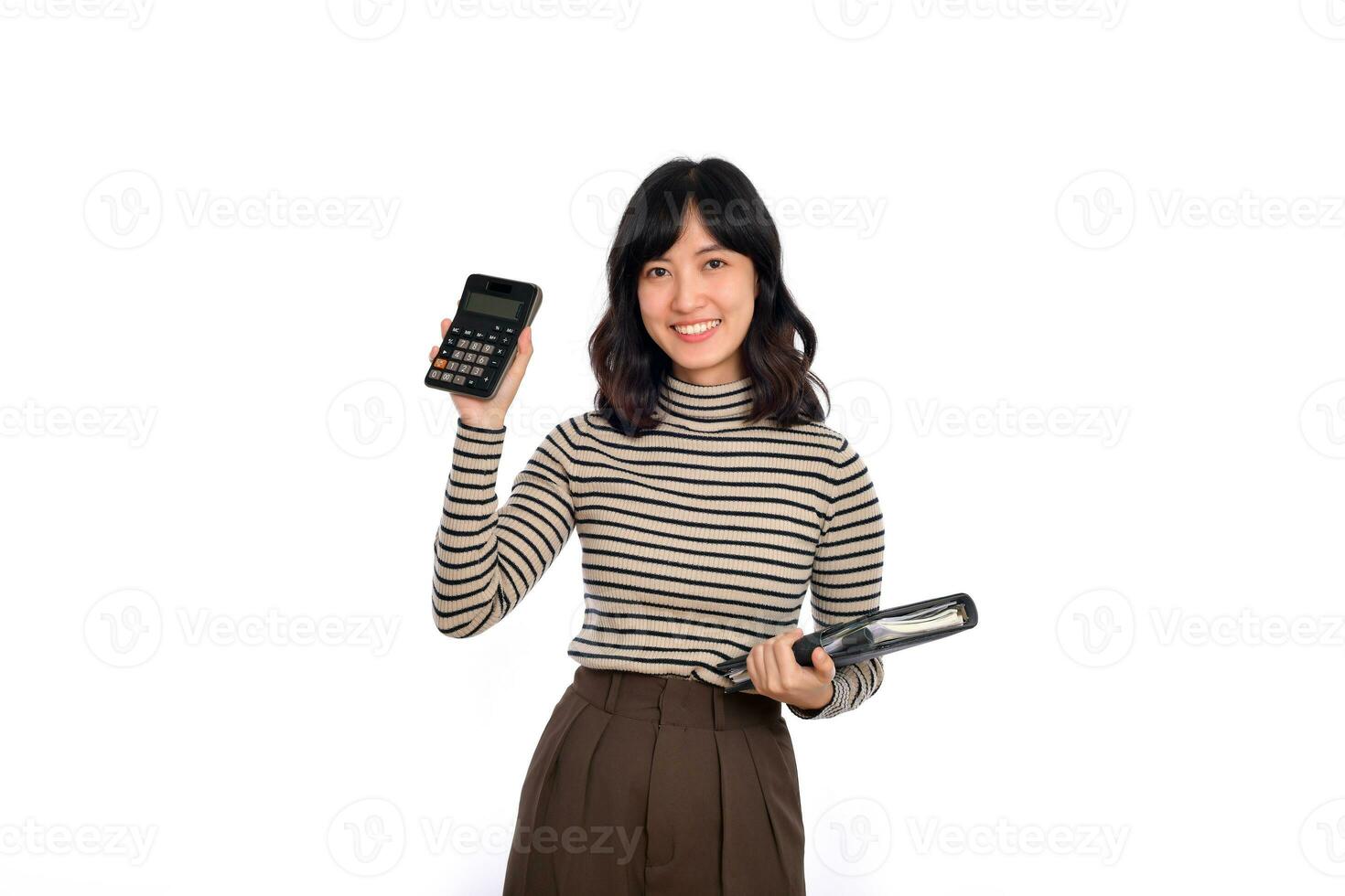 Portrait of young Asian woman casual uniform holding white piggy bank and notebook isolated on white background. Financial and bank saving money concept photo