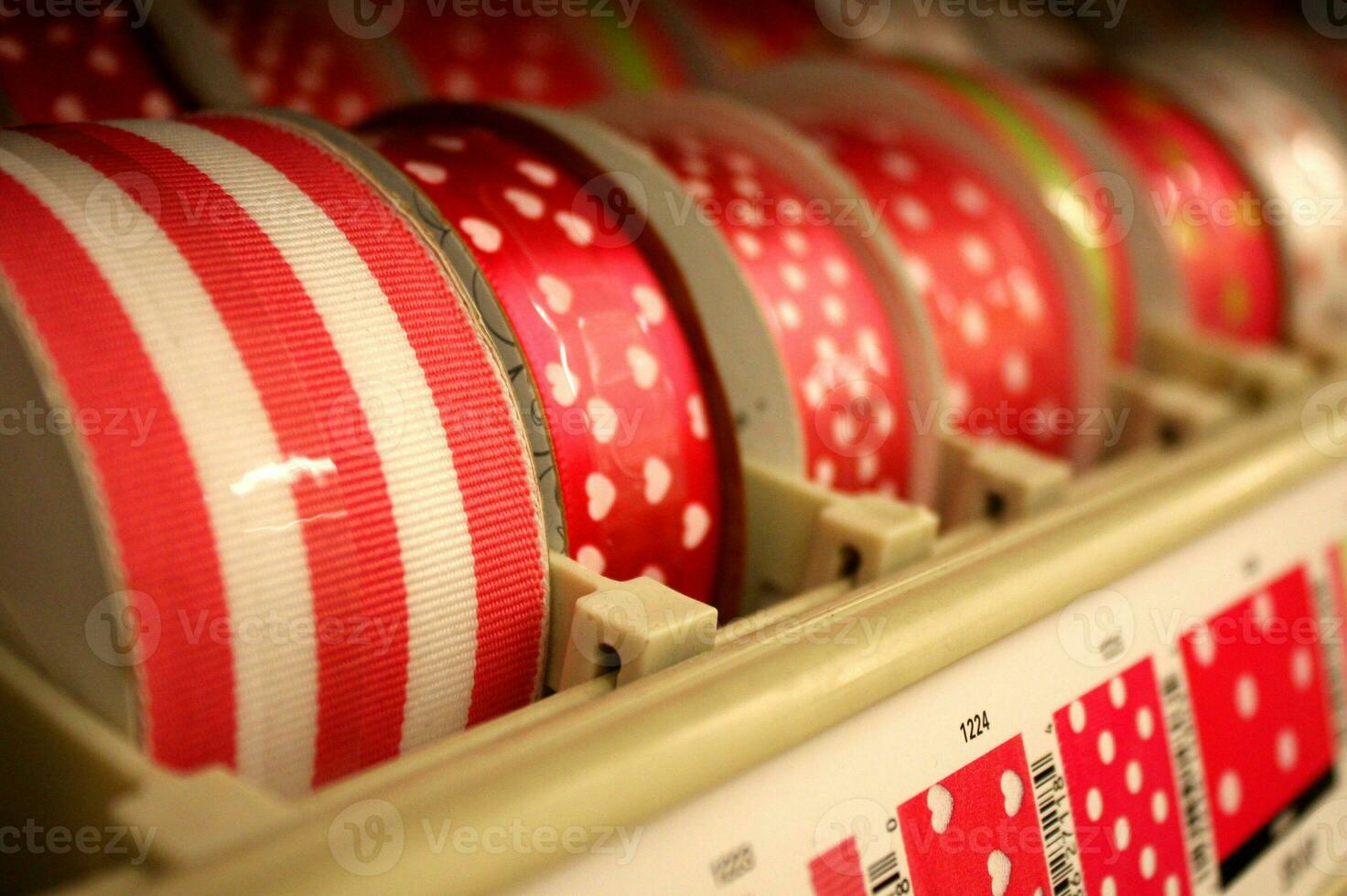 Spools of Red Patterned Ribbon on Display photo
