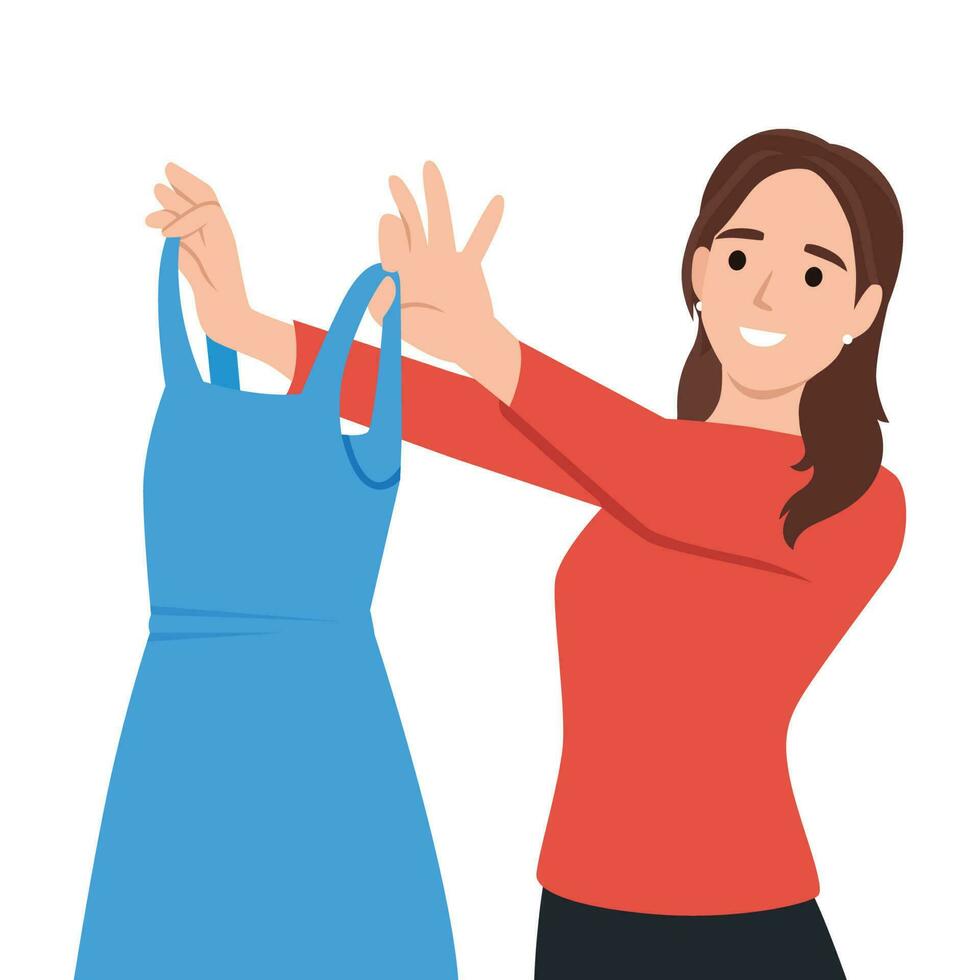 Woman examines beautiful evening dress choosing outfit for going to ball or festive party. Girl shopping in clothing store holds elegant dress from latest collection from famous fashion designer vector