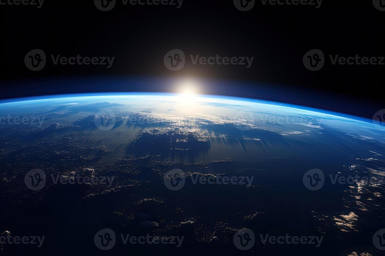 Sunrise view of the planet Earth from space with the sun setting over the horizon. photo