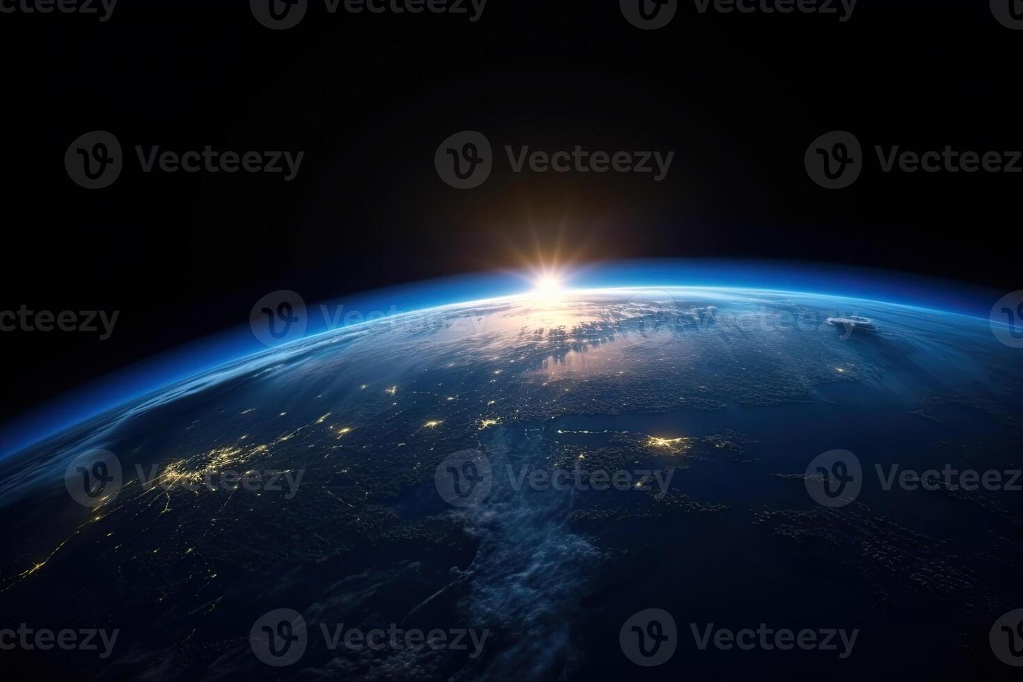 Sunrise view of the planet Earth from space with the sun setting over the horizon. photo