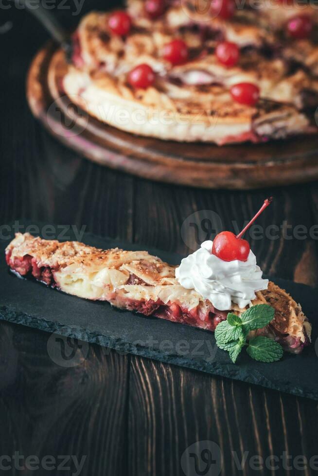 Portion of cherry custard pie photo