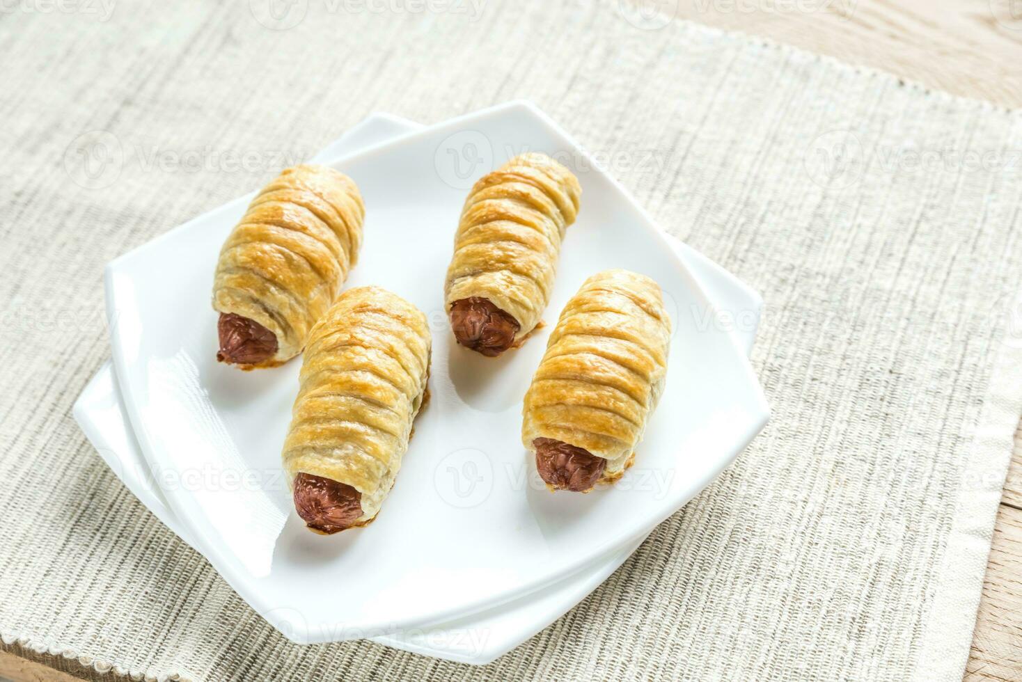 Sausage rolls in plate photo