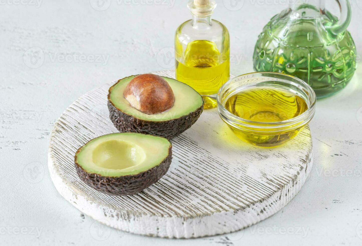 Fresh avocado with avocado oil photo
