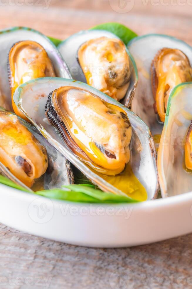 Baked half shell mussels 23491359 Stock Photo at Vecteezy