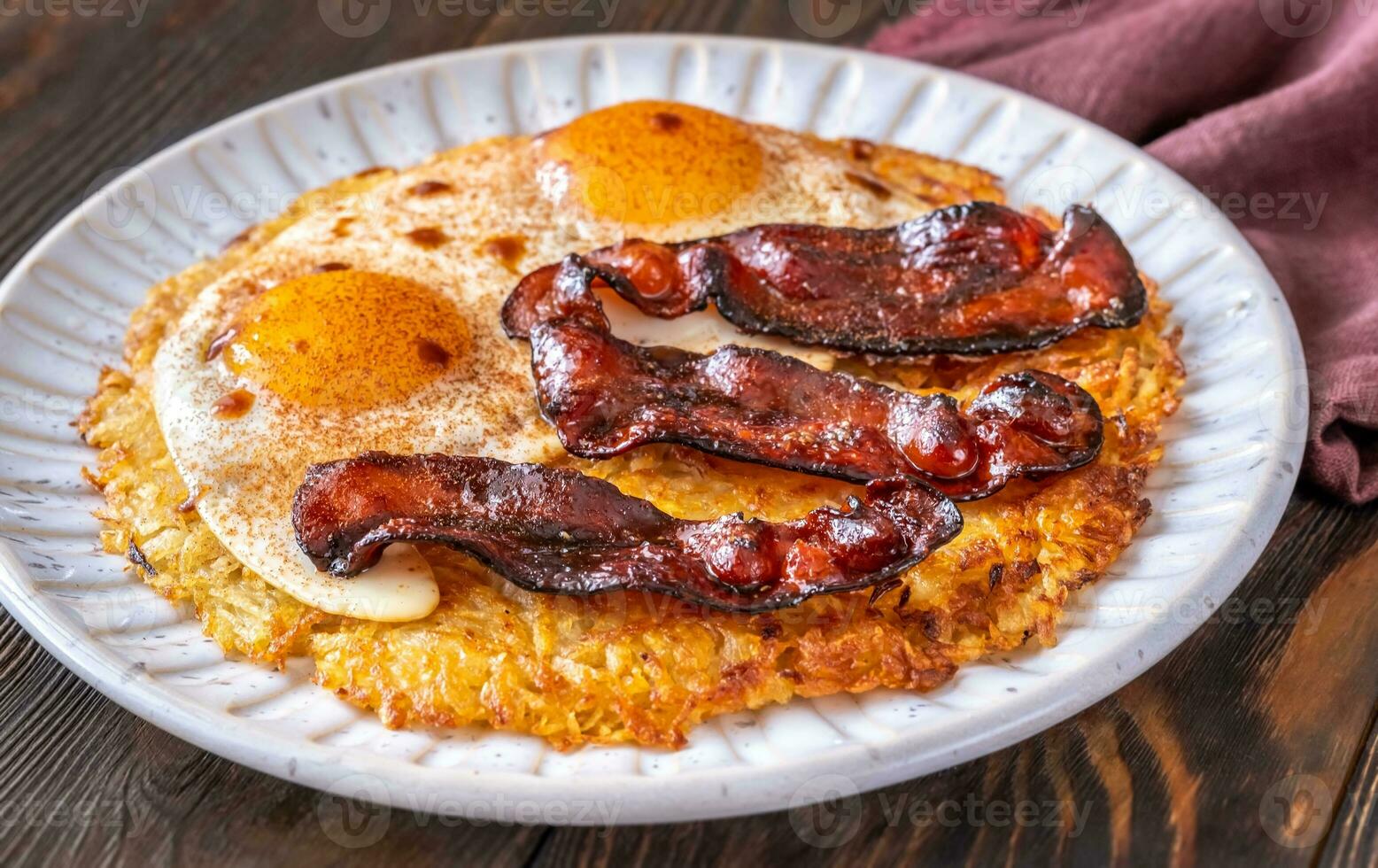Hash brown with egg and bacon photo