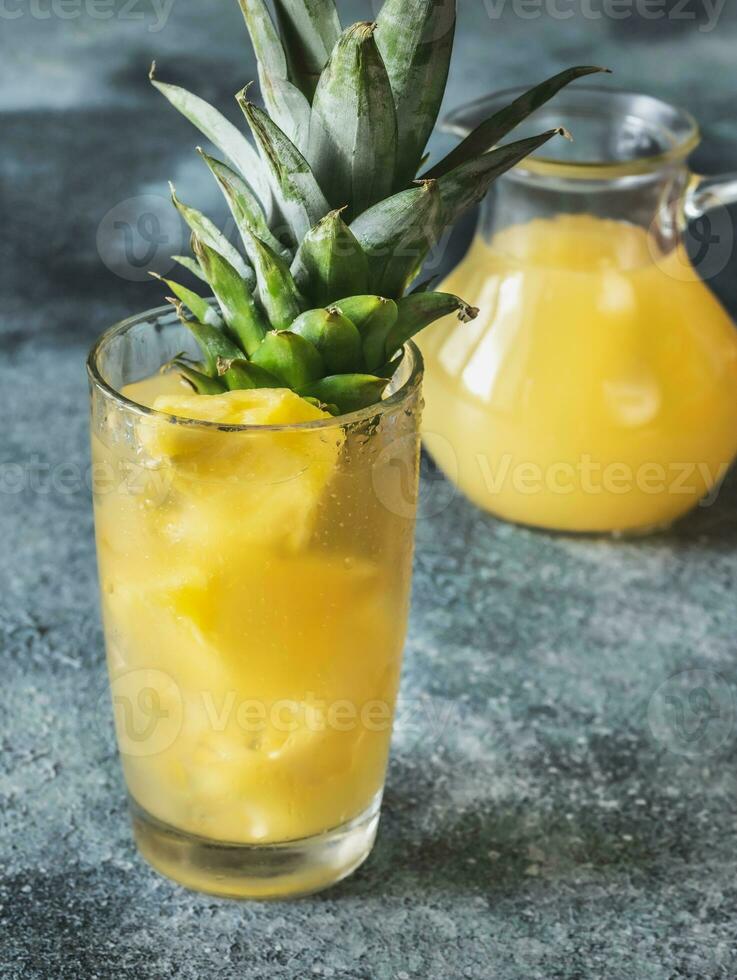 Glass of pineapple juice photo