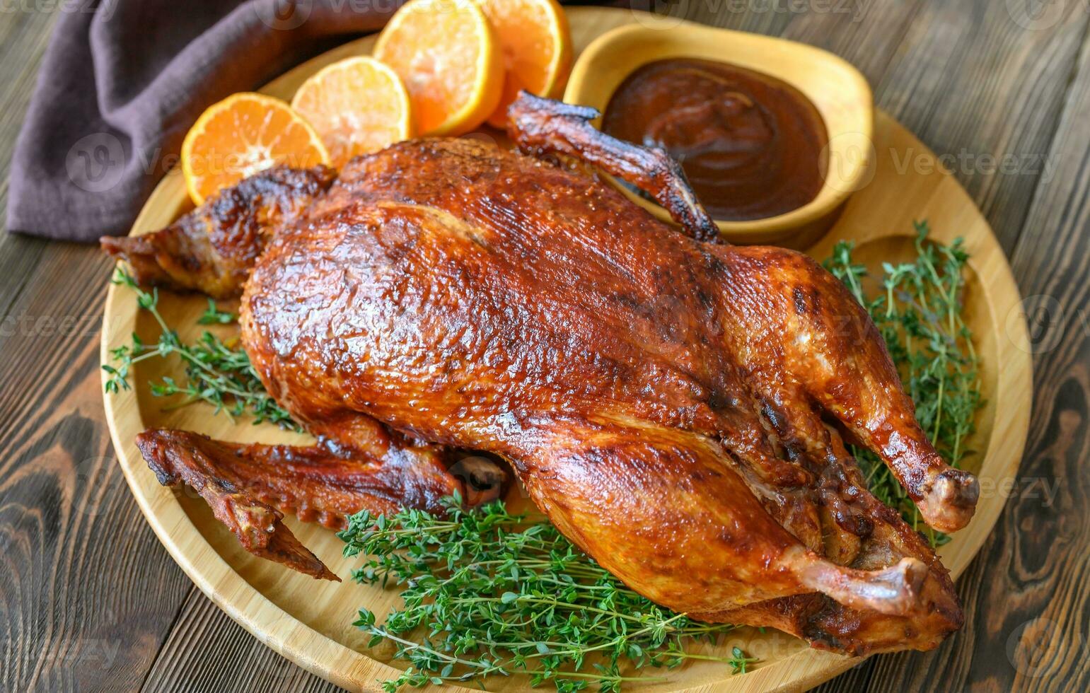 Baked duck on wooden tray photo