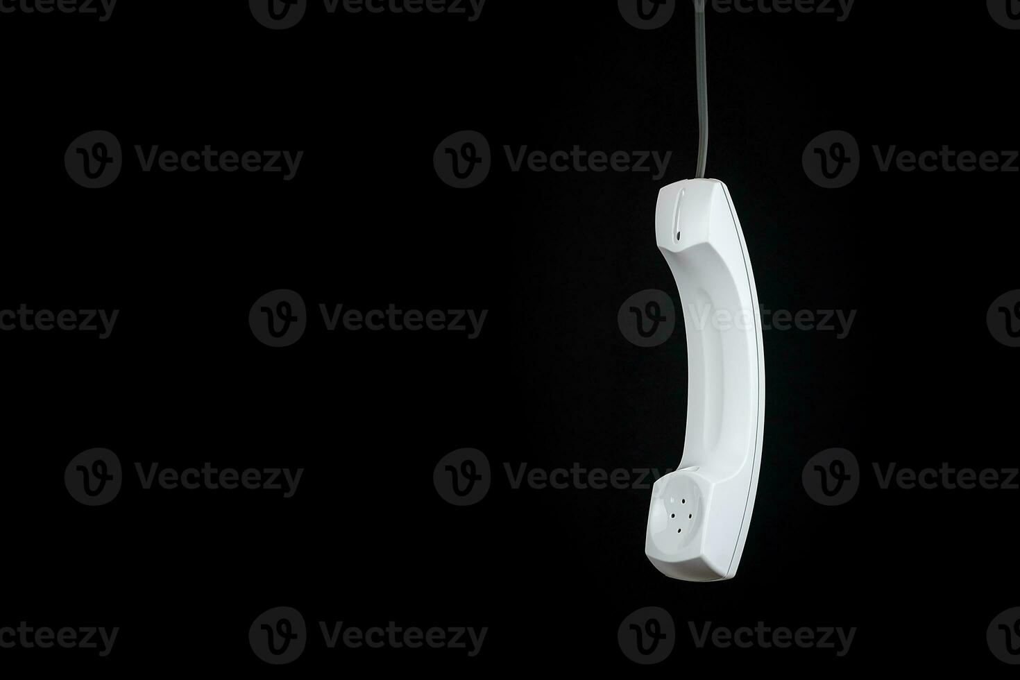 White telephone receiver with copy space photo