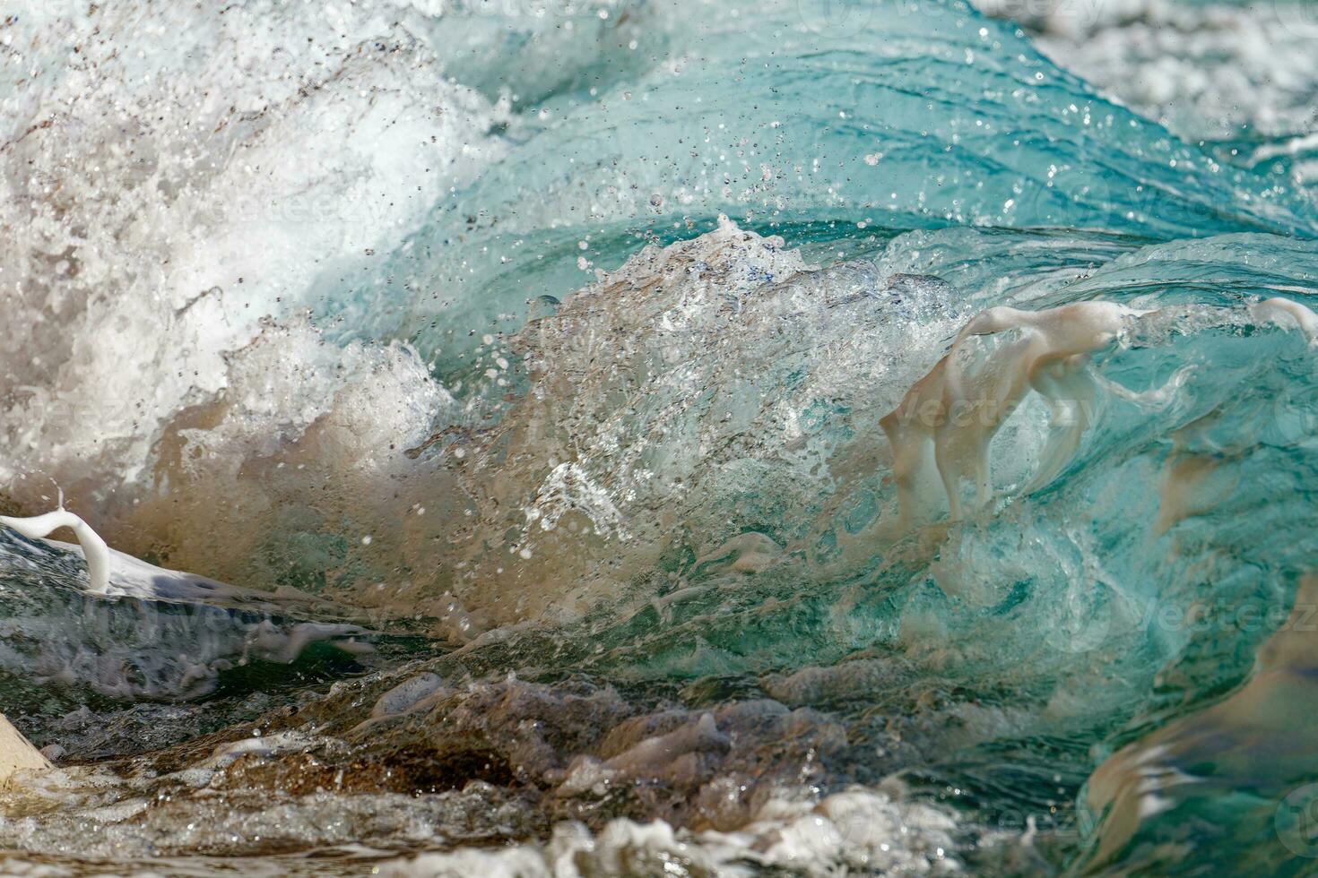 Waves crashing on the beach. Summertime. Travel concept. Backgrounds and textures. photo